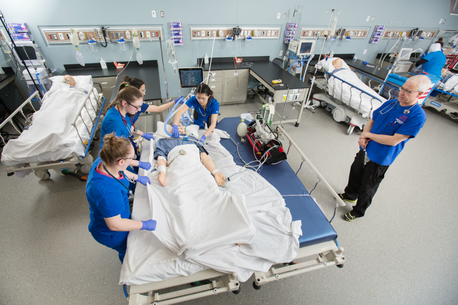 NAIT respiratory therapy students practice on a high fidelity mannequin