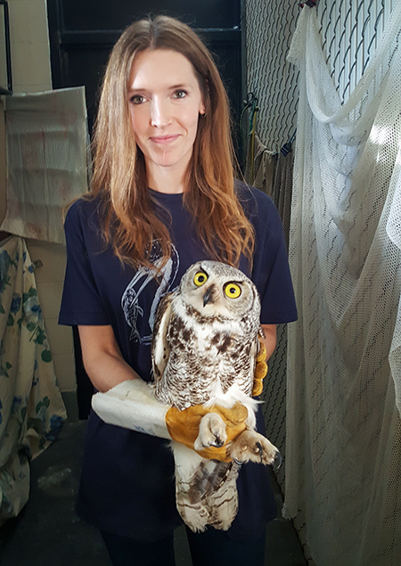 Jade Murphy with a rescued owl at Wild North