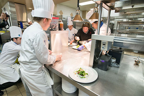 Lynn Crawford works with NAIT Culinary Arts students as Hokanson Chef in Residence
