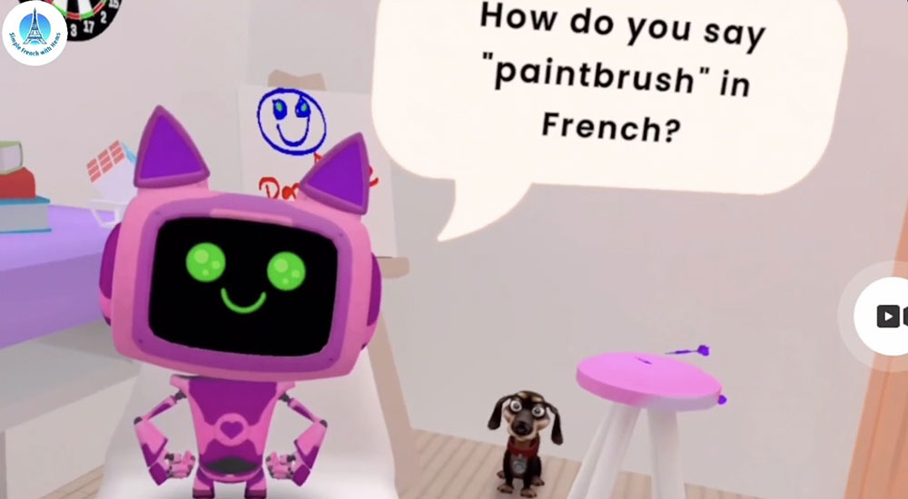 A colorful virtual reality scene shows a cartoon robot with a speech bubble asking how to say “paintbrush” in French, inside an animated room.