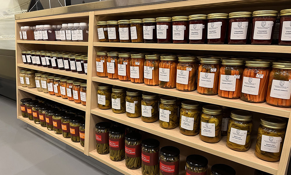 rows of preserves on a shelf at NAIT's artisanal market