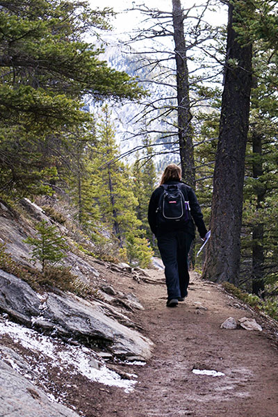hiker on banff's commonwealth walkway