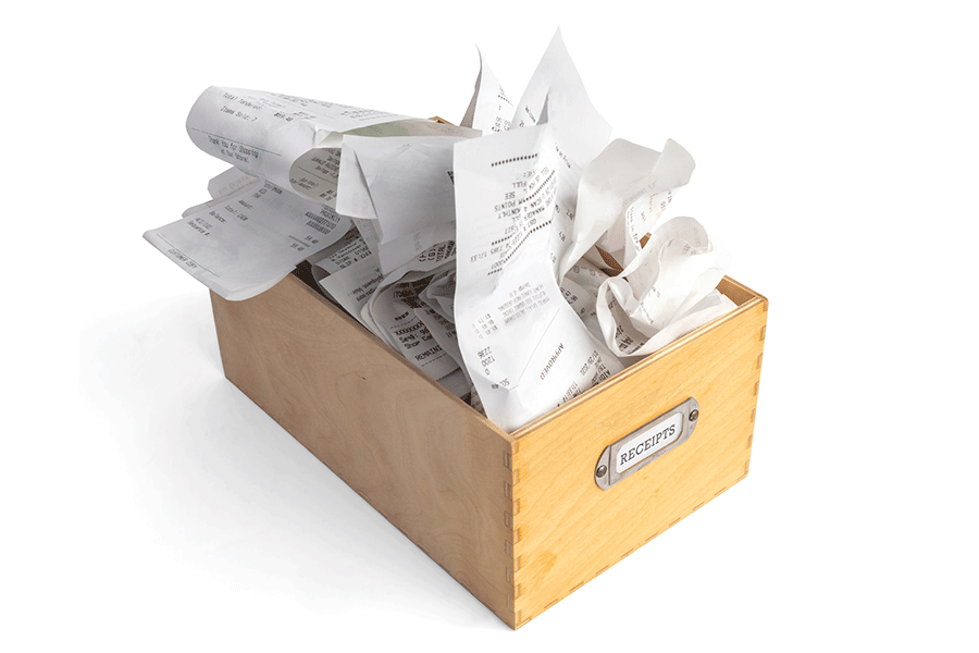 wooden box full of receipts
