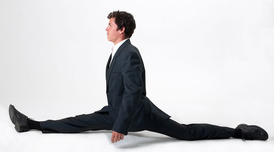 businessman doing the splits