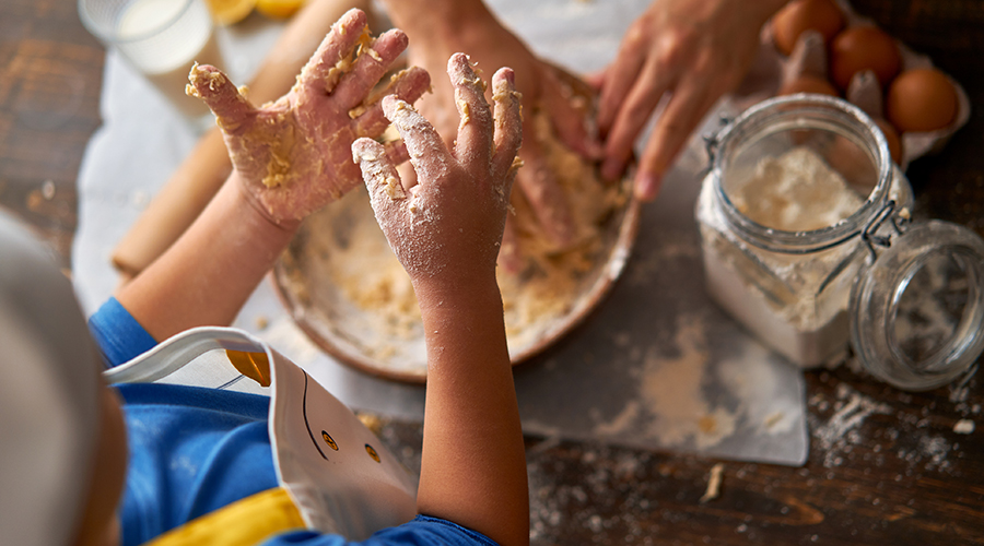 kids and parent with messy hands from baking