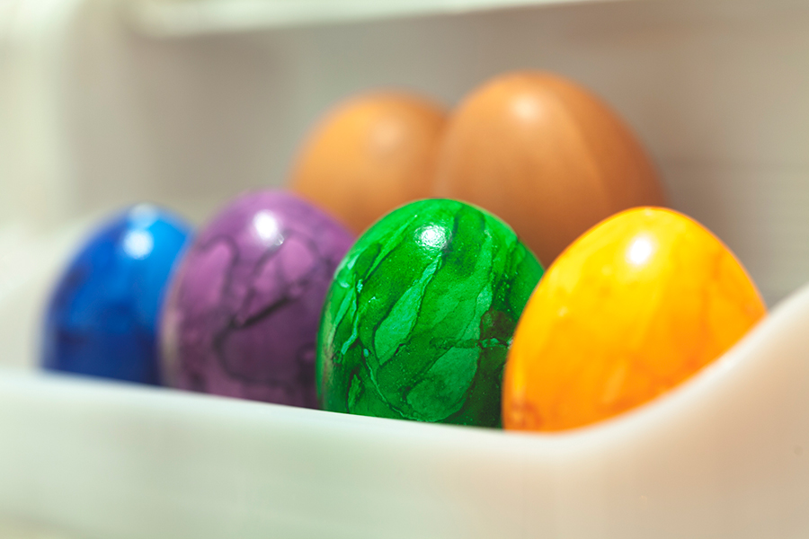 coloured easter eggs in refrigerator