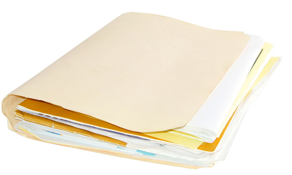 A manila file folder stuffed with assorted papers and documents, partially open and overflowing.