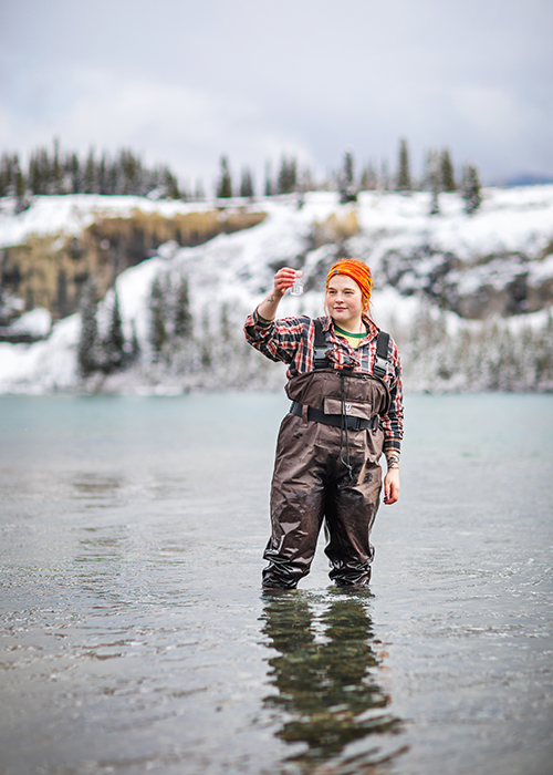 nait student taking water sample from river in Nordegg, Alberta