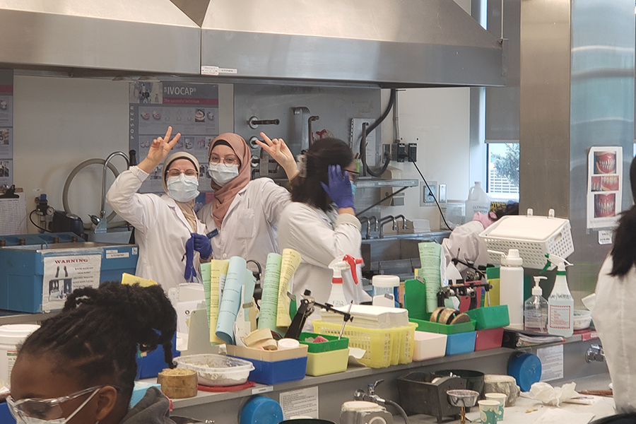 two girls in head scarves in nait med lab tech program