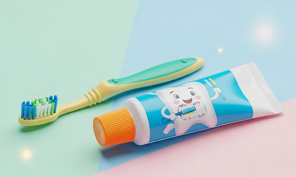 Children’s toothbrush and toothpaste with a cartoon tooth character on colorful pastel backgrounds.