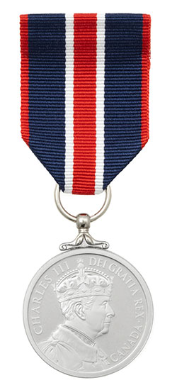 A silver medal with a profile of a crowned figure and the inscription 'CHARLES III DEI GRATIA REX CANADA,' attached to a ribbon with vertical blue, white, and red stripes.