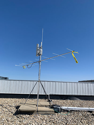 photo of motus wildlife tracking system tower and receiver on roof at nait campus in edmonton