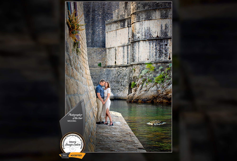 award-winning wedding photo by railene hooper featuring a bride and groom beside a canal