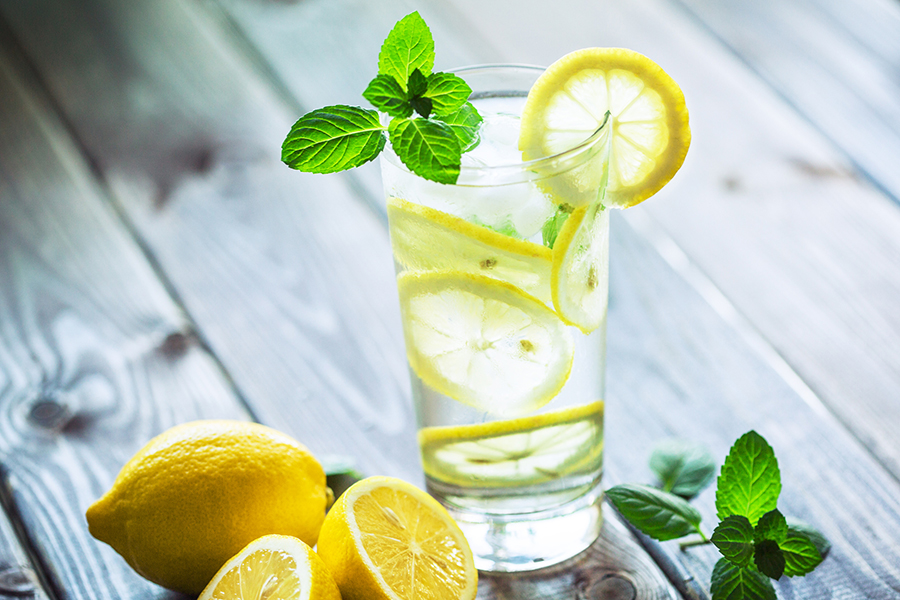 glass of water with lemons and mint