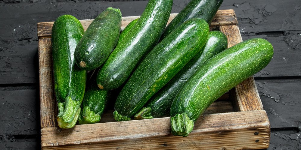 photo of wooden box of zucchini