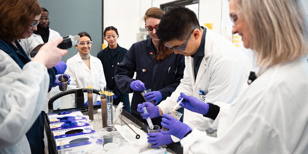 researcher working in a lab at nait