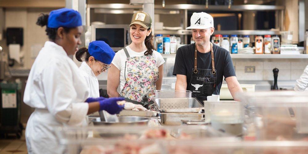 2022 hokanson chefs in residence connie desousa and john jackson teaching students at in a NAIT kitchen