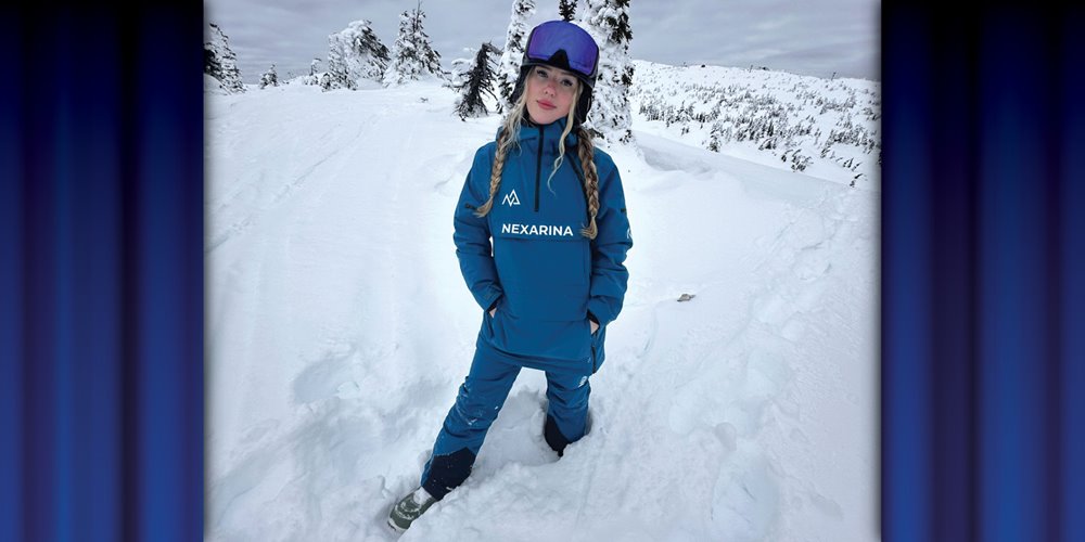 photo of mikayla balfour on a snowy hill with spruce trees in the background