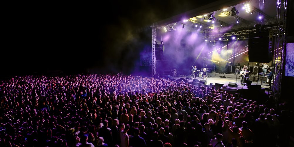 outdoor music festival stage at night
